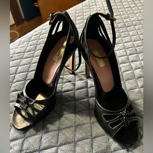 Prada black peep toe pumps with sexy cut outs  around the heel.  Size 37.5.